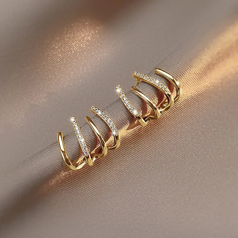 Vridne Øreringe | Elegant Design | Guld eller Sølv
